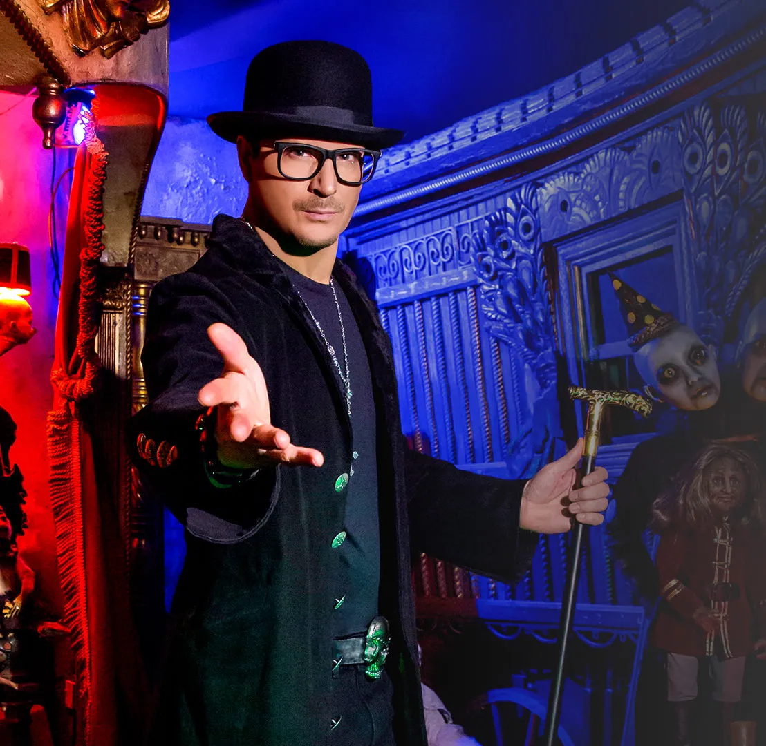 mobile-about-row zak bagans with glasses and top hat
